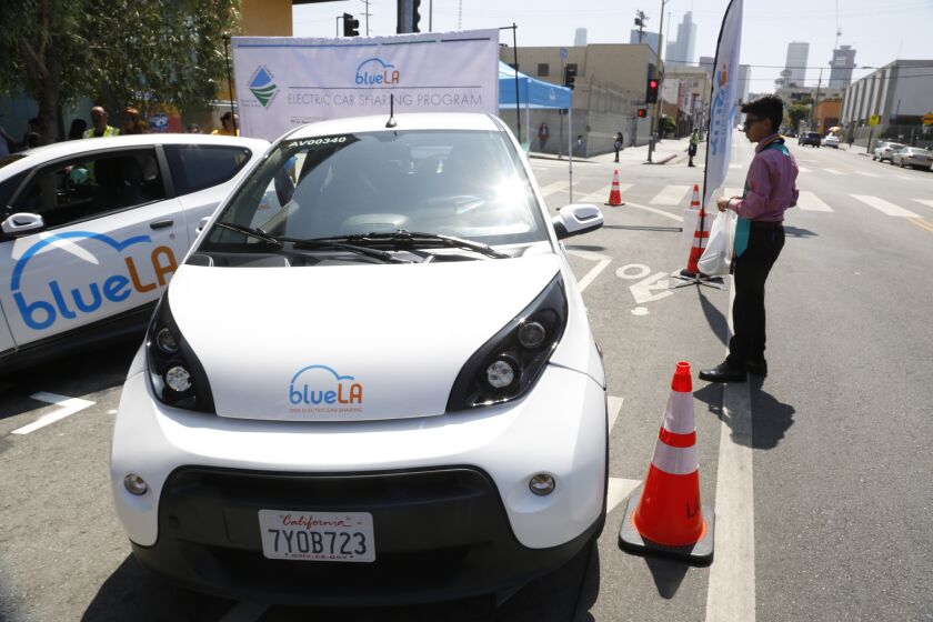 LOS ANGELES, CA, JUNE 9, 2017: One of the BlueLA cars in the new ride sharing program is parked on 7th Street during a press roll-out June 9, 2017. BlueLA, a new ride sharing service, aims to provide low-income neighborhoods with low emission (all electric) transportation. The new service was rolled-out for the public during a press conference on 7th Street at Bonnie Brae in Los Angeles where the actual car charging stations are located (Mark Boster / Los Angeles Times ).