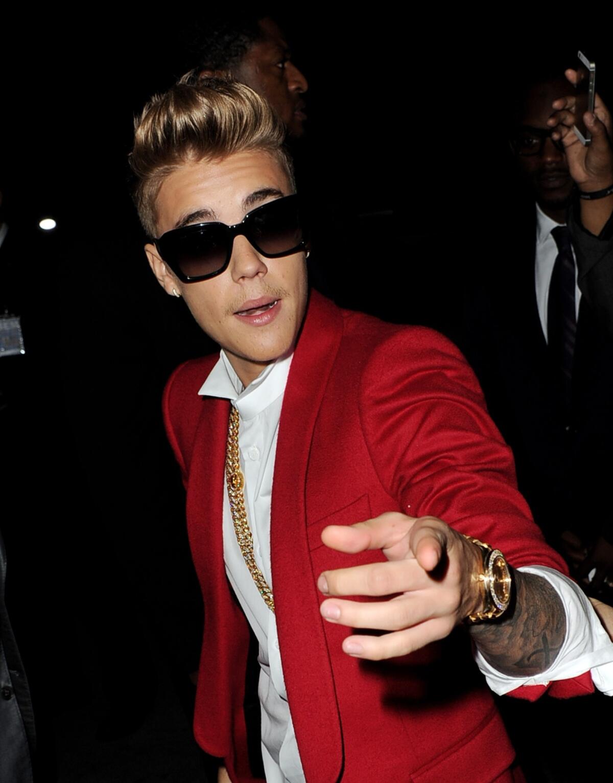 Justin Bieber is a suspect in a vandalism investigation after one of his neighbor's reported that his house was egged by the pop star, Los Angeles County sheriff's deputies said. Bieber, above, appears at the premiere for "Justin Bieber's Believe" at the Regal Cinemas L.A. Live on Dec. 18, 2013.