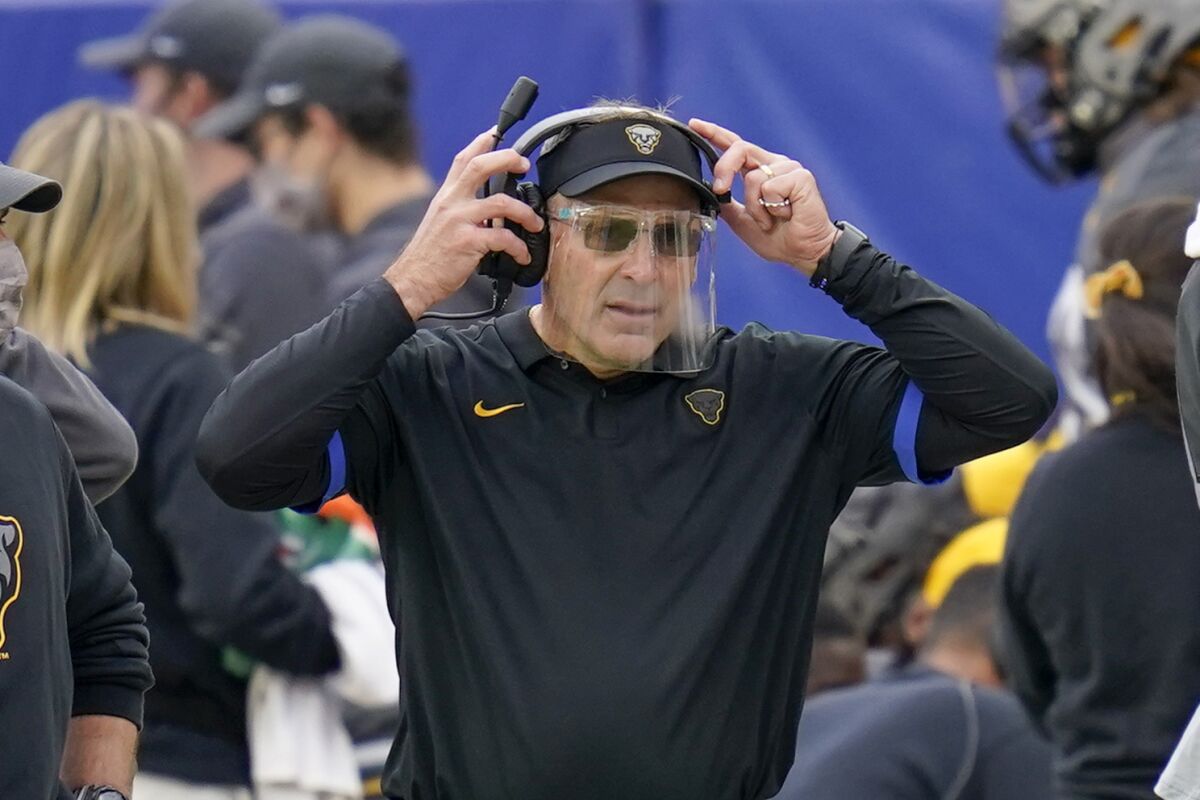 Pittsburgh coach Pat Narduzzi wears a face shield along the sideline as his team plays against Notre Dame on Oct. 24, 2020.