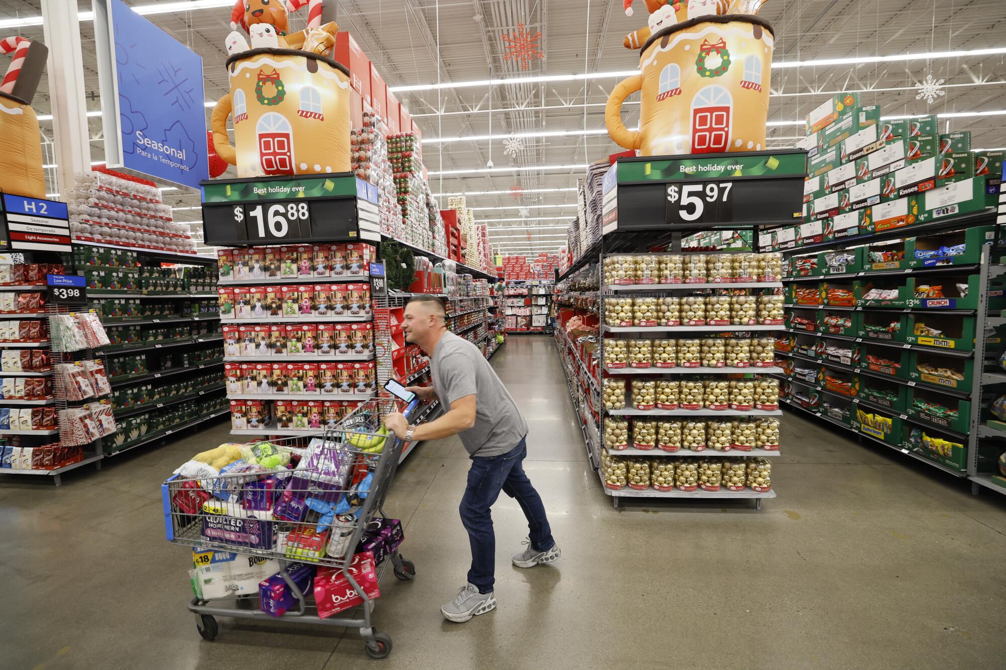 A man pushing a shopping cart at the Walmart Supercenter in Burbank
