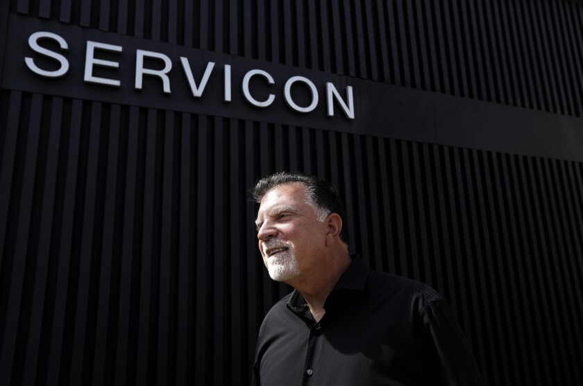 Michael Mahdesian, chairman of Servicon, stands outside his janitorial company (Genaro Molina / Los Angeles Times)