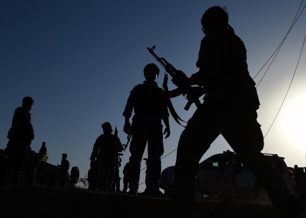 In Kunduz, Afghan military personnel patrol during fighting between Taliban militants and security forces in early October. The fighting in Kunduz underscored the deep security woes in Afghanistan that have eroded confidence in the government, according to polls.