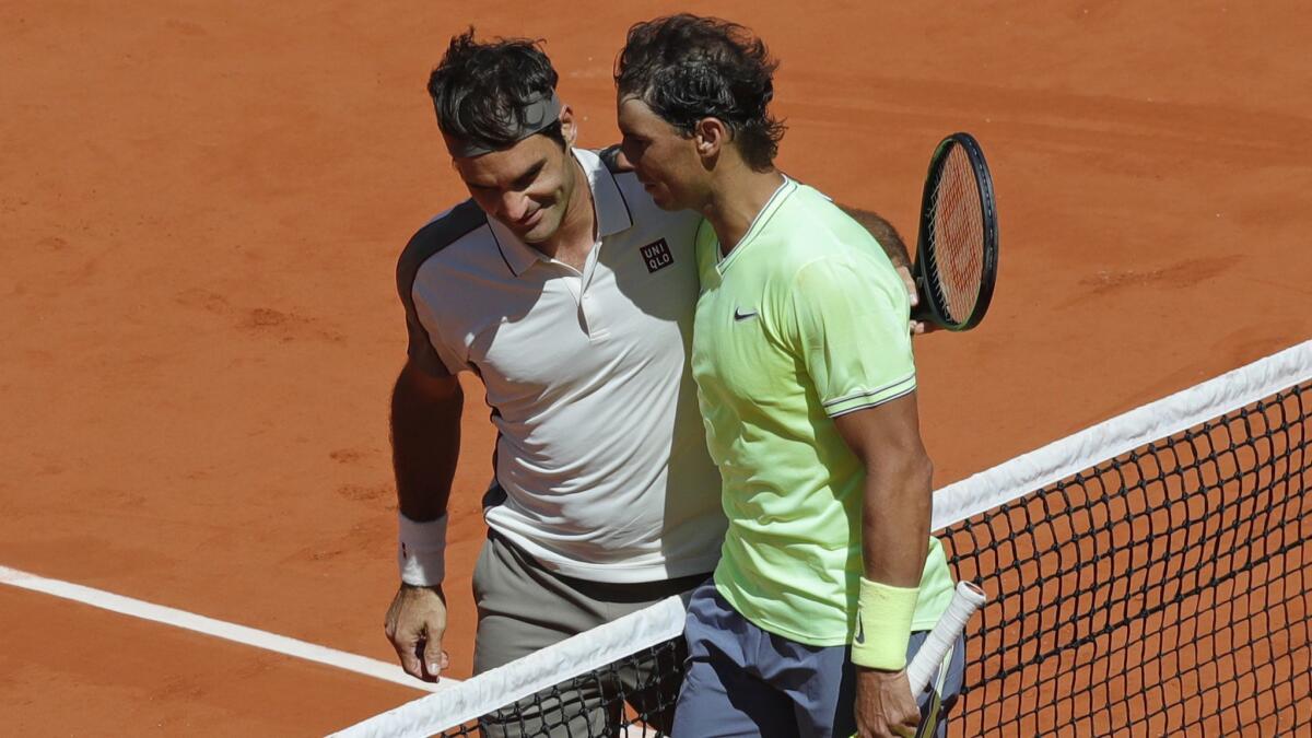 Rafael Nadal, right, is congratulated by Roger Federer after winning their semifinal match of the French Open on Friday.