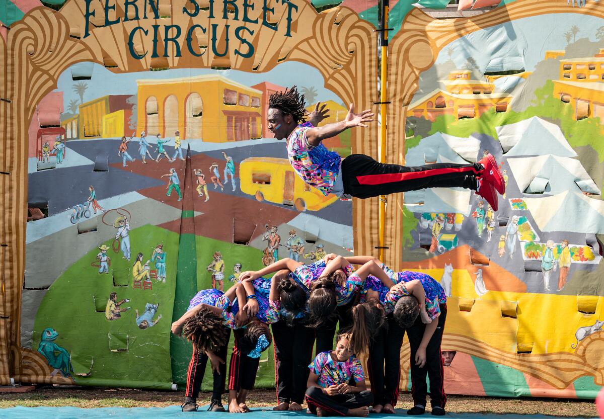 Guinean acrobat Idrissa Bangoura flies through the air at a Fern Street Circus performance.