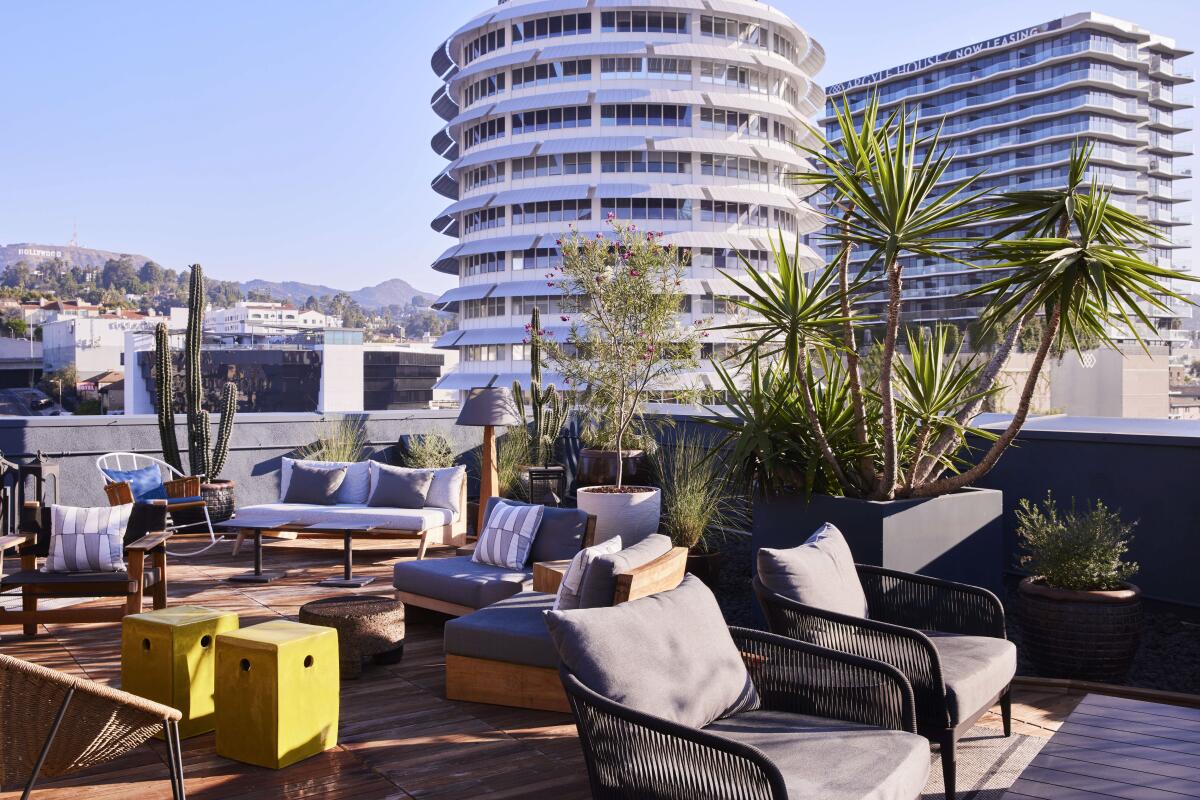 outdoor rooftop with Capitol Records building in background 