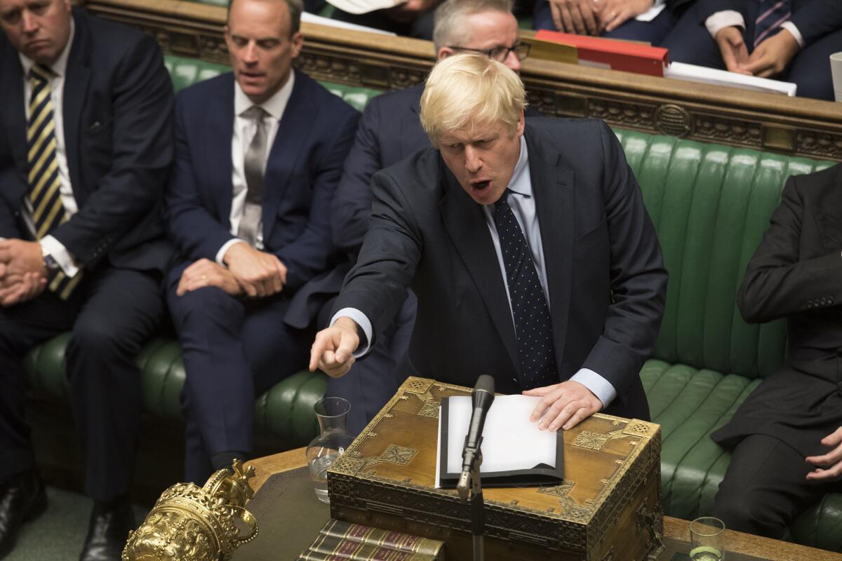 In this image released by the House of Commons, Britain's Prime Minister Boris Johnson speaks in the House of Commons, London, Tuesday Sept. 3, 2019 after MPs voted in favor of allowing a cross-party alliance to take control of the Commons agenda on Wednesday in a bid to block a no-deal Brexit on October 31. (Jessica Taylor/House of Commons via AP)