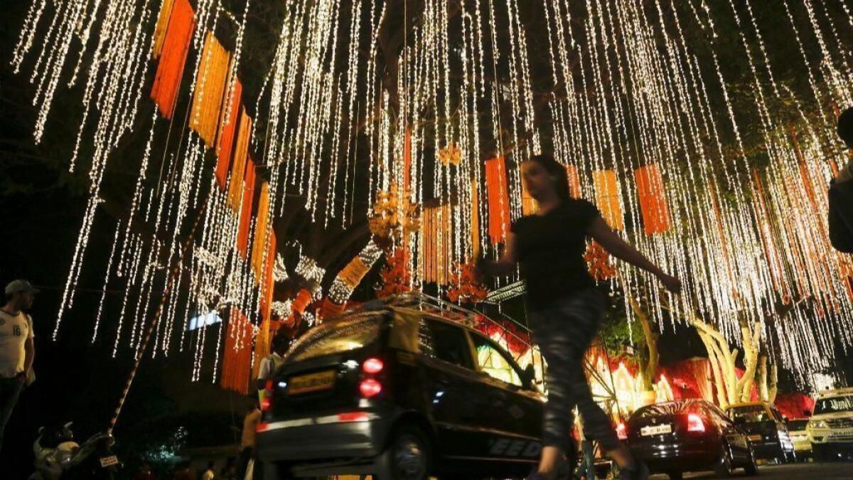 A street outside the Mumbai home of Reliance Industries' Chairman Mukesh Ambani is illuminated Tuesday prior to his daughter Isha's wedding.