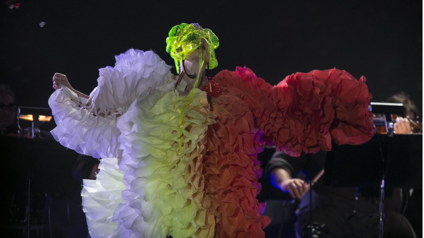 Wearing a lime-green face mask and a dress that made her look like a living party streamer, Icelandic singer Bjork belts out material from throughout her expansive catalog during her performance at FYF.