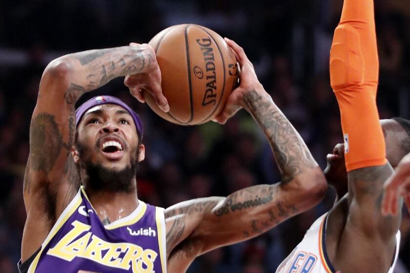 LOS ANGELES, CALIF. - JAN. 2, 2019. Lakers forward Brandon Ingram goes to the basket against Thunder forward Dennis Schroder in the second quarter Wednesday , Jan. 2, 2019, at Staples Center in Los Angeles. (Luis Sinco/Los Angeles Times)
