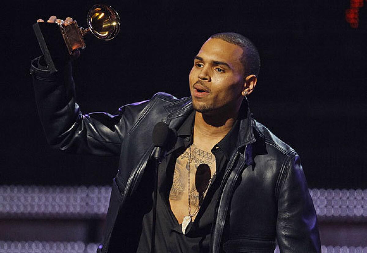 Chris Brown accepts his trophy during the 54th annual Grammy Awards at Staples Center in Los Angeles on Feb. 12.