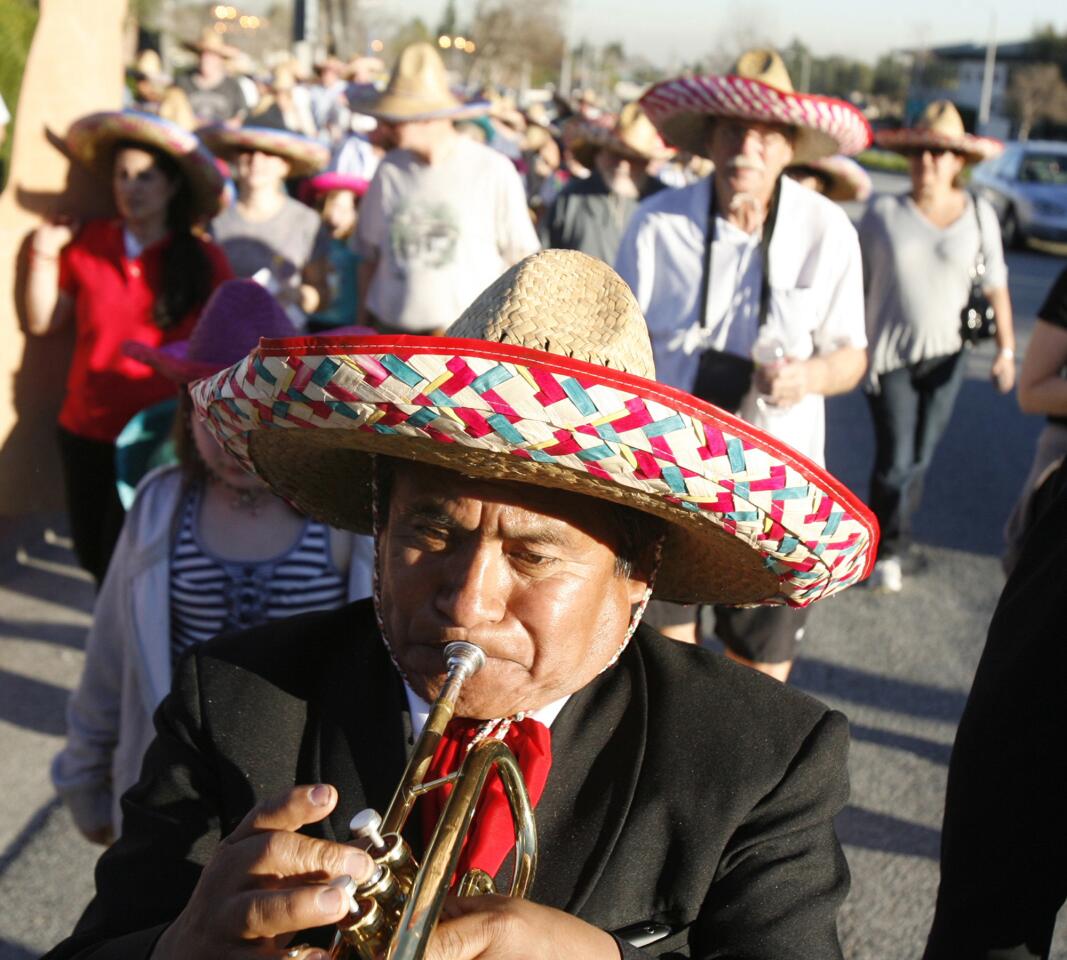 Lead by a Mariachi band, dozens of parade marchers assisted the long time restaurant Los Gringos Locos make a ceremonial move of the last of the supplies from the old location to the new one two blocks west on Foothill Blvd. in La Canada Flintridge on Thursday, January 26, 2012.