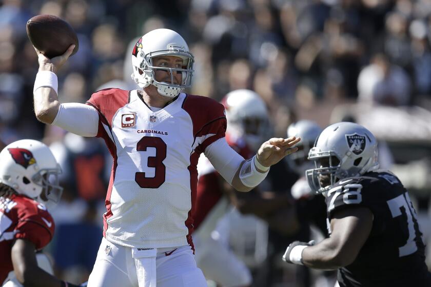 Arizona quarterback Carson Palmer completed 22 of 31 passes for 253 yards with two touchdowns and an interception Sunday against Oakland.