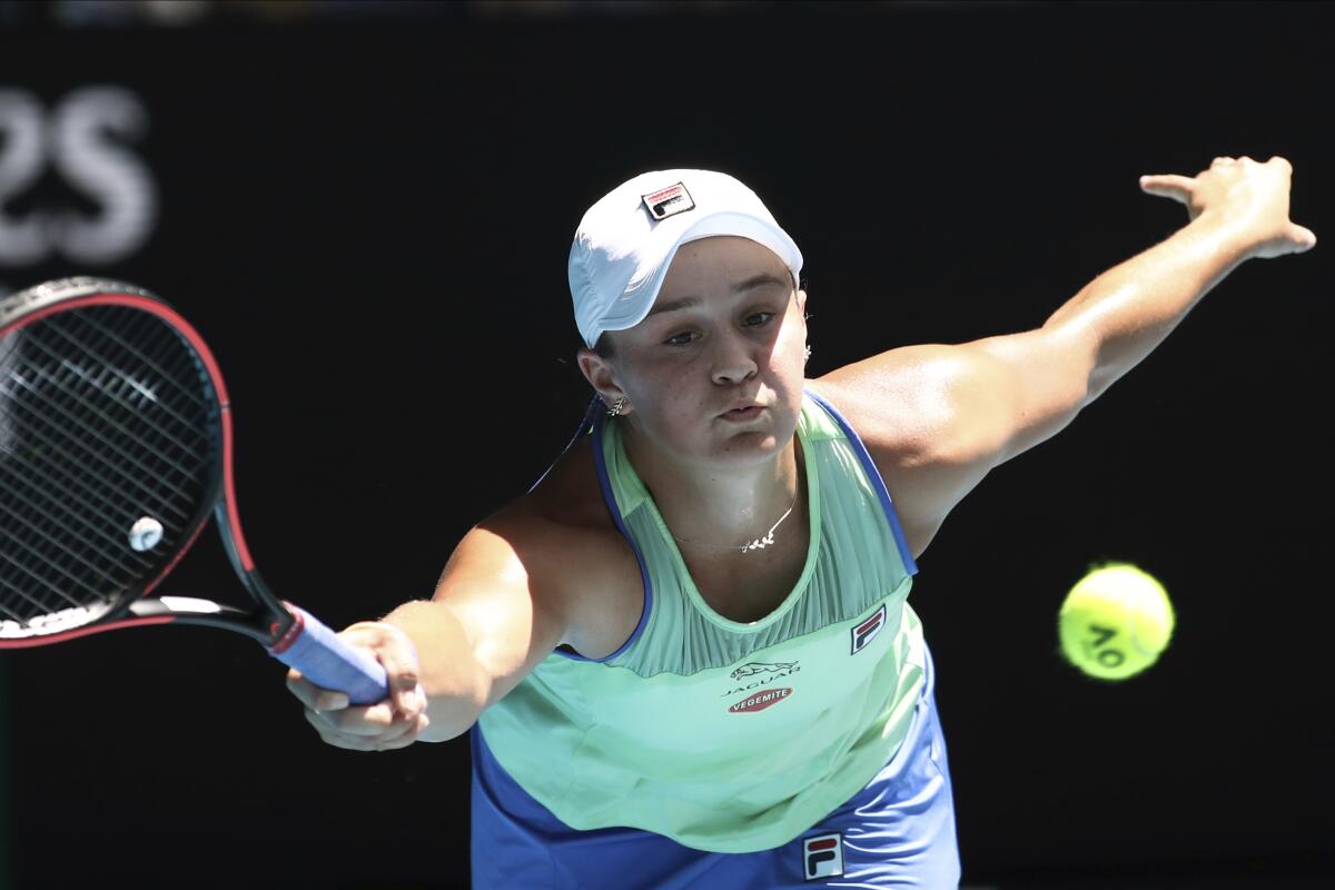 Ash Barty stretches for a forehand return against Petra Kvitova during the Australian Open.