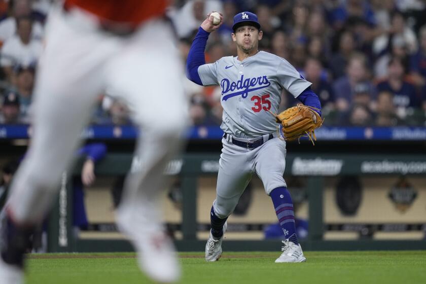 Dodgers starting pitcher Gavin Stone throws out Houston Astros designated hitter Yordan Alvarez on a ground ball