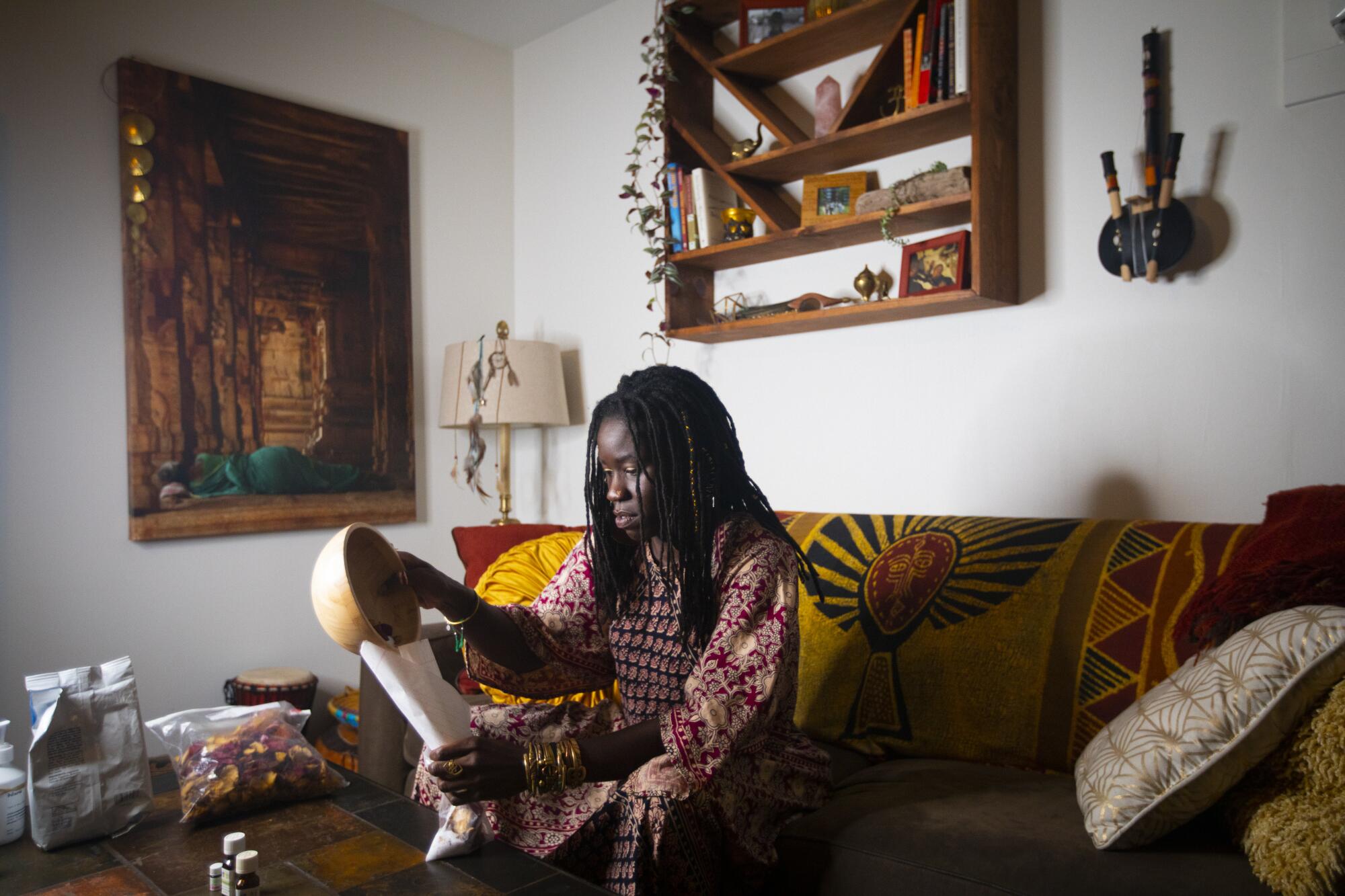 Self care is important to Alua Arthur, she prepares a bath including rose peddles and epsom salt.