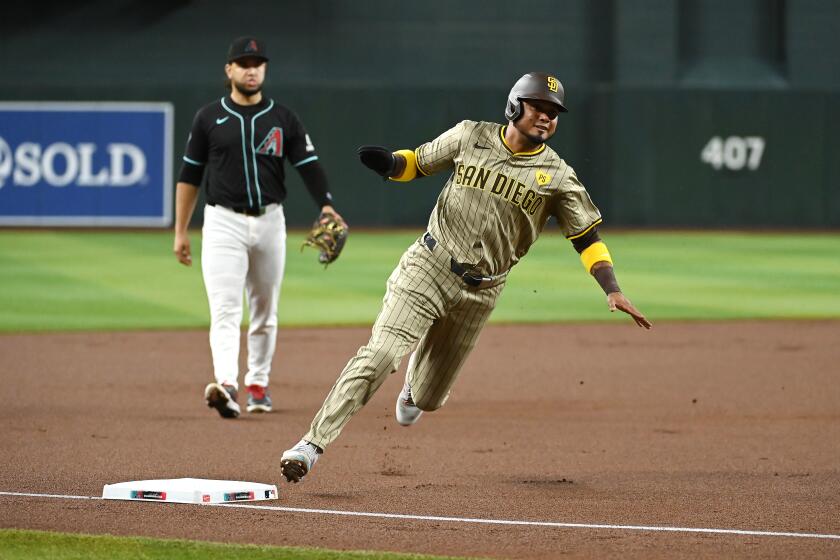 PHOENIX, ARIZONA - MAY 04: Luis Arraez #4 of the San Diego Padres rounds third base on a single hit by Jake Cronenworth #9 against the Arizona Diamondbacks during the first inning at Chase Field on May 04, 2024 in Phoenix, Arizona. (Photo by Norm Hall/Getty Images)