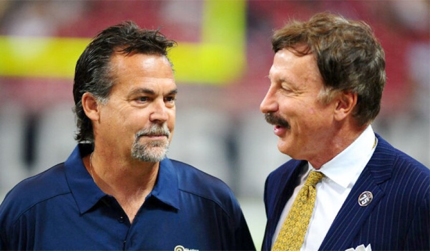 St. Louis Rams Coach Jeff Fisher talks with the team's owner Stan Kroenke prior to a game at the Edward Jones Dome on Sept. 8. Kroenke recently acquired a parcel of land in Los Angeles which could be used to build and NFL stadium.