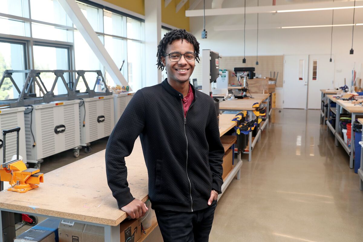 William Parker, 20, stands in his former Samueli Academy school's engineering lab.