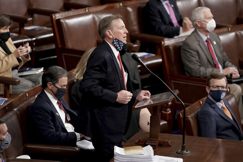 Rep. Paul Gosar, R-Ariz., objects to Arizona's Electoral College certification from the 2020 presidential election as a joint session of the House and Senate convenes to confirm the Electoral College votes cast in November's election, at the Capitol in Washington, Wednesday, Jan. 6, 2021. (Greg Nash/Pool via AP)