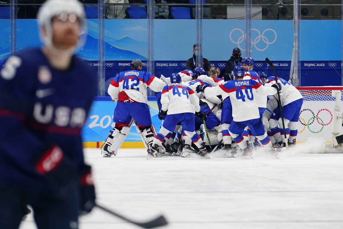 Slovakia hockey players celebrate at the 2022 Olympics. 