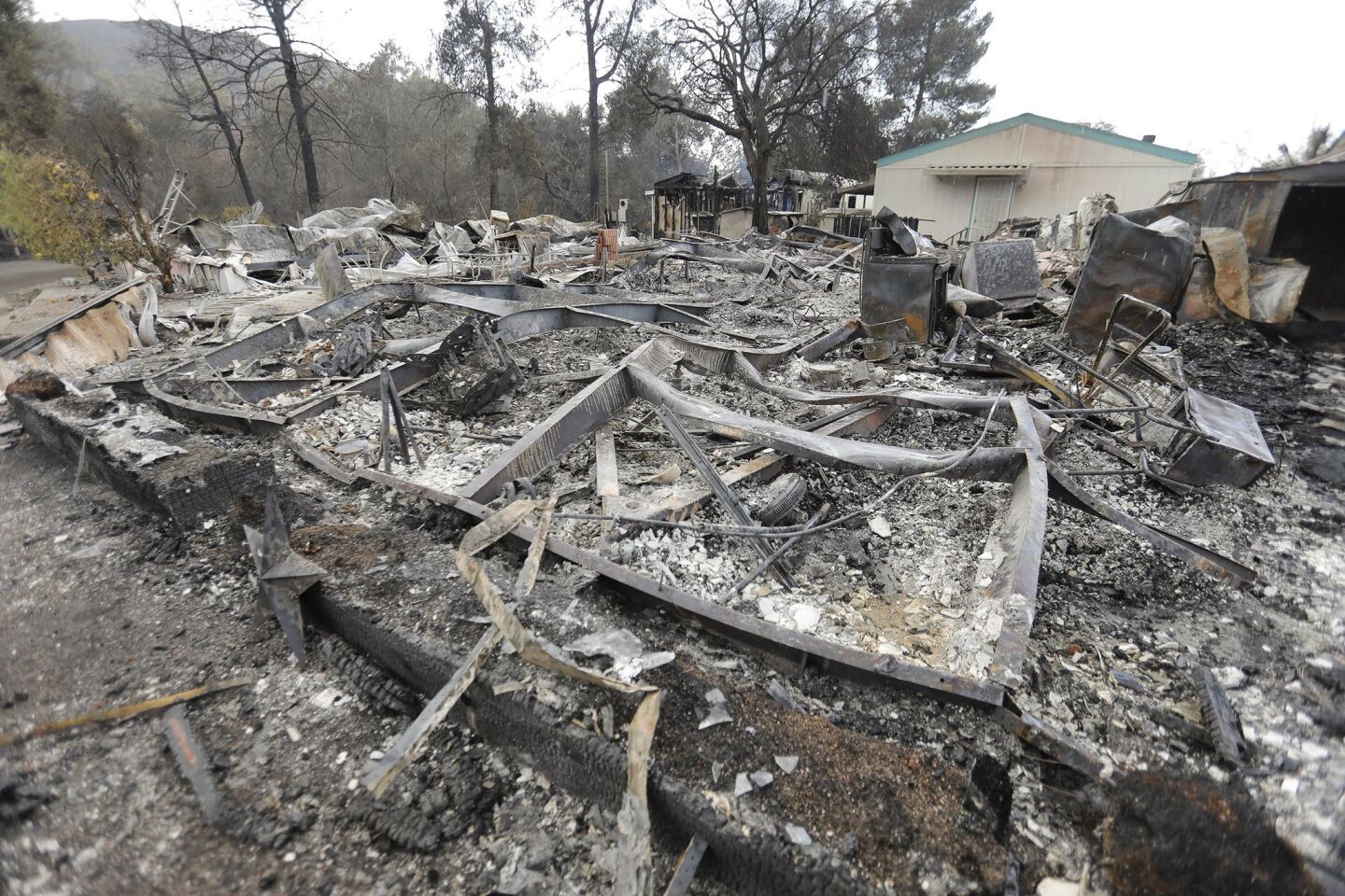 The charred remains of a mobile home in the Alpine Oaks Estates.