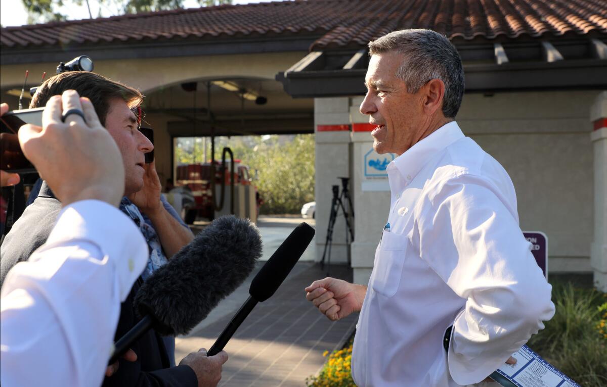 House candidate Doug Applegate speaks to members of the media in front of the Carlsbad Fire Station on election day.