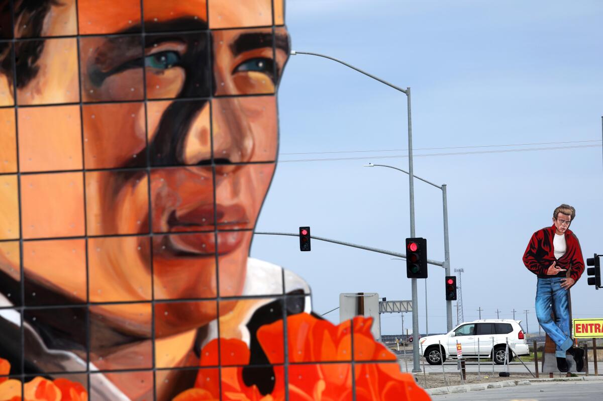 Gigantic wood paneled images of actor James Dean draw visitors to Blackwells Corner General Store in Kern County.