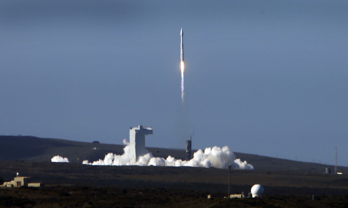 The Atlas V rocket carrying a NASA and USGS Landsat 8 satellite lifts off from Vandenberg Air Force Base.