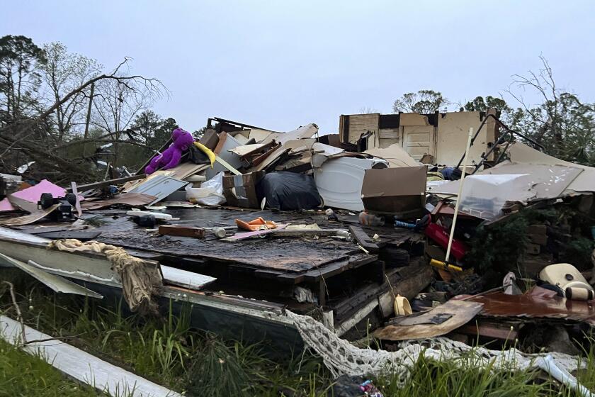 Damage is seen at a house on South Main Street in Pembroke, Ga., 30 miles from Savannah, after a storm passed through the city, Tuesday, April 5, 2022. (AP Photo/Lewis Levine)