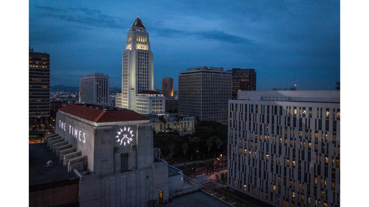 March 28, 2013: Photo of Los Angeles Times building and Los Angeles City Hall taken from roof of Times South building.