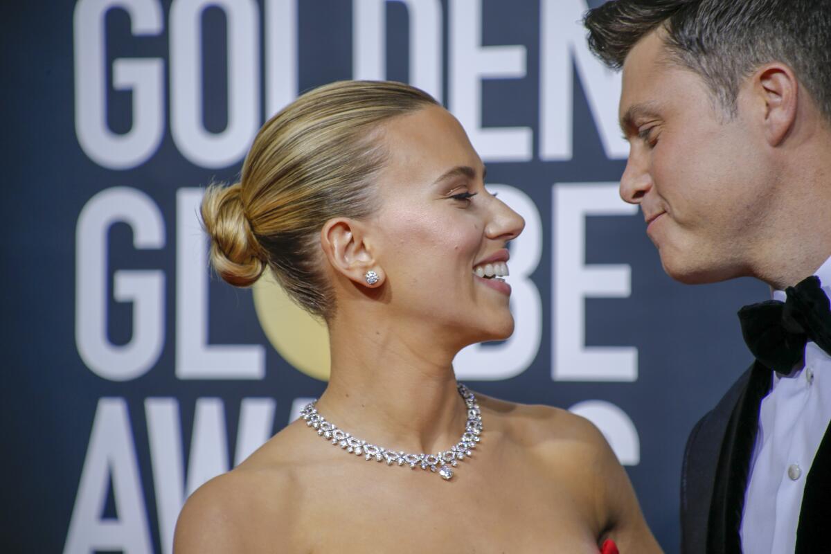 Scarlett Johansson (left, with fiancé Colin Jost) is nominated in the supporting actress category for her role in "Jojo Rabbit."