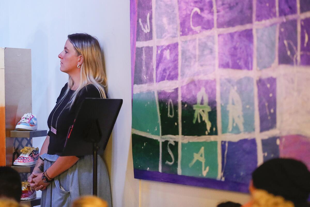 Betina Genovesi watches the one-person play "Painted Words" at the Laguna Beach Cultural Arts Center.