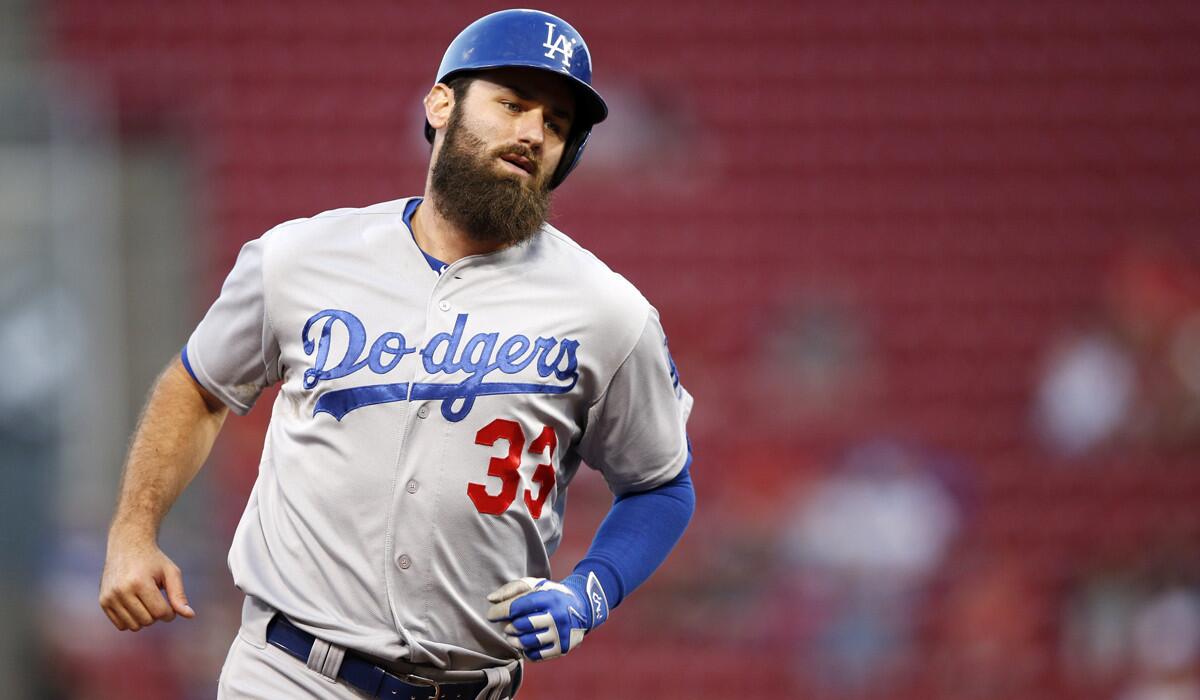 Dodgers' Scott Van Slyke rounds the bases after hitting a solo home run against the Cincinnati Reds on Aug. 26.