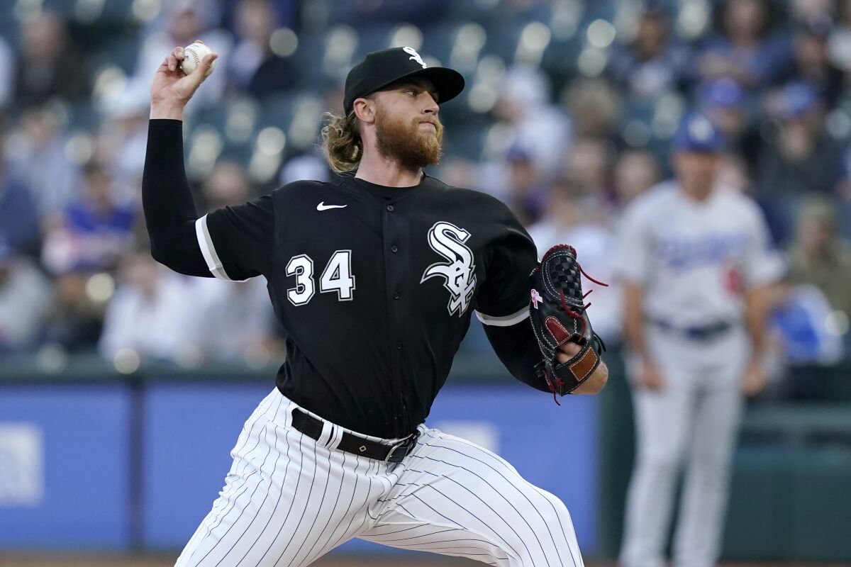 Chicago White Sox starting pitcher Michael Kopech delivers during the first inning of the team's baseball game against the Los Angeles Dodgers on Tuesday, June 7, 2022, in Chicago. (AP Photo/Charles Rex Arbogast)