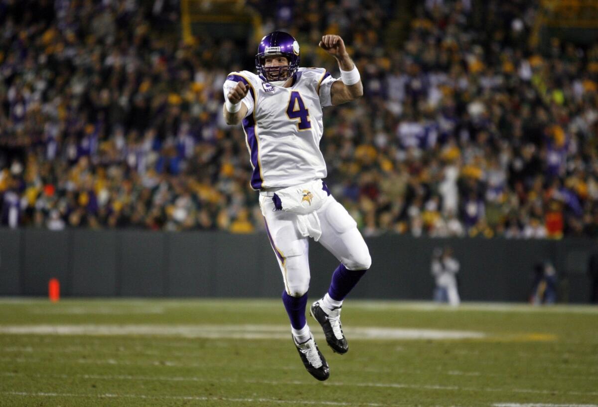 Brett Favre celebrates his fourth touchdown pass during the Minnesota Vikings' 38-26 victory over the Green Bay Packers at Lambeau Field in 2009.