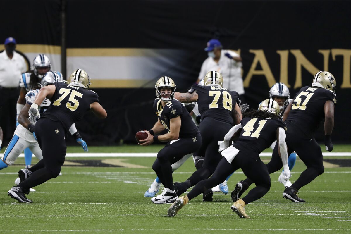 New Orleans Saints quarterback Drew Brees looks to pass during a game against the Carolina Panthers.