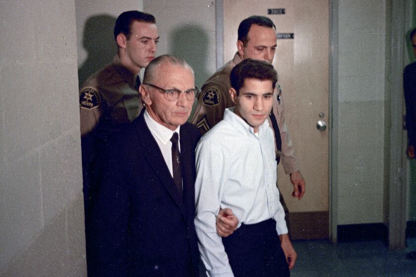 FILE - This June 1968 photo shows Sirhan Sirhan, right, accused assassin of Sen. Robert F. Kennedy, with his attorney Russell E. Parsons in Los Angeles. In 2021, a California parole board voted to free Robert F. Kennedy's assassin but the decision was overturned by the governor. Sirhan Sirhan will once again appear before the board Wednesday, March 1, 2023, at a hearing at a federal prison in San Diego County to again seek their approval for his release. (AP Photo/File)