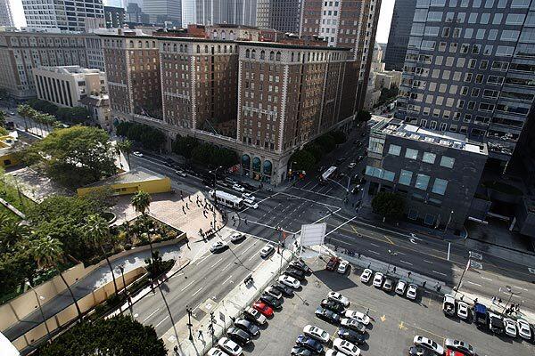 A parcel of land at Olive and 5th streets now used for parking near Pershing Square in downtown Los Angeles was intended for a 76-story condominium tower and a 14-story five-star hotel. The Park Fifth project is on hold amid a glut of condos and as hotels struggle.