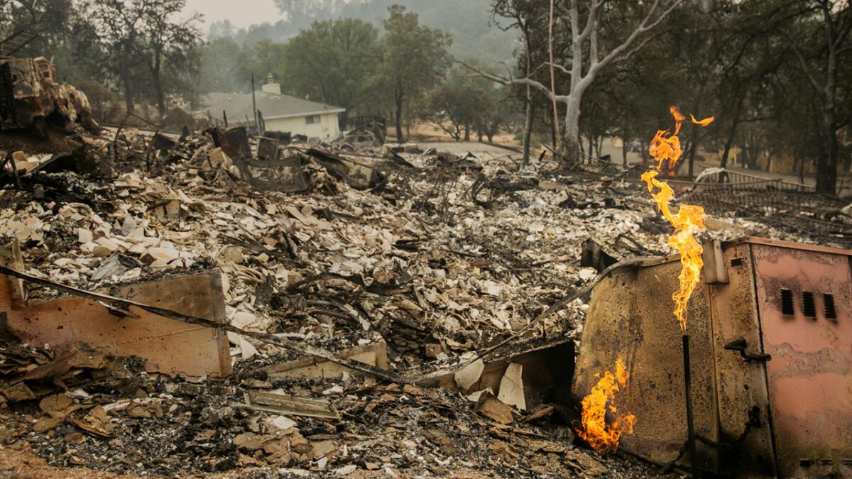 The Valley fire tore through a half dozen homes in the residential community of Hidden Valley Lakes, near Middletown, Calif.