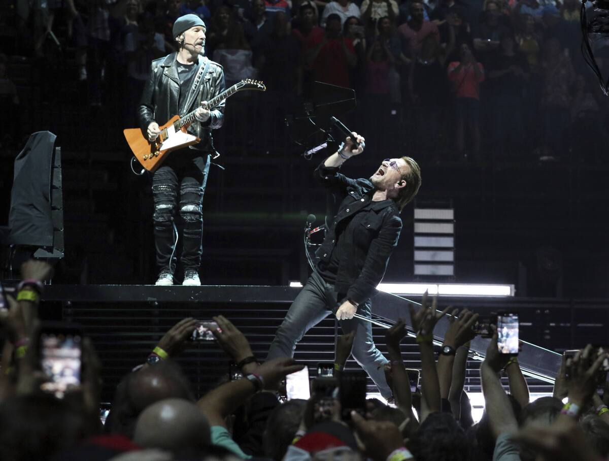 Bono and the Edge of the band U2 perform onstage.