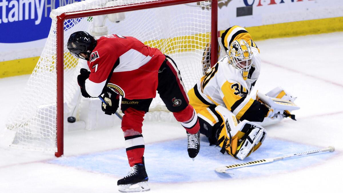 Senators center Kyle Turris (7) scores against Penguins goalie Matt Murray (30) during the second period of Game 3 on Wednesday.
