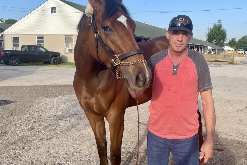 Trainer and Del Mar regular Val Brinkerhoff stands with Kentucky Oaks qualifier Where's My Ring on Thursday at Churchill Downs in Louisville, Ky.