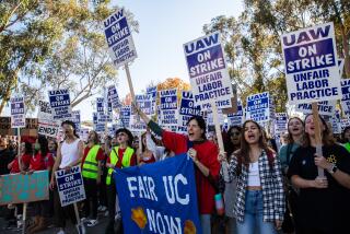 San Diego, CA - November 14: UC San Diego academic workers strike in front of Geisel Library at UC San Diego in San Diego, CA on Monday, Nov. 14, 2022 calling for higher wages and other demands. The strike part of a walk-off among 48,000 unionized academic workers across the University of California's 10 campuses.(Adriana Heldiz / The San Diego Union-Tribune)