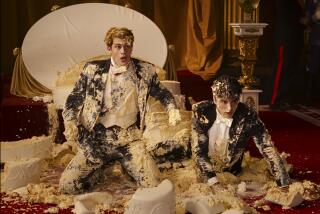 Two handsome young men covered in wedding cake frosting.