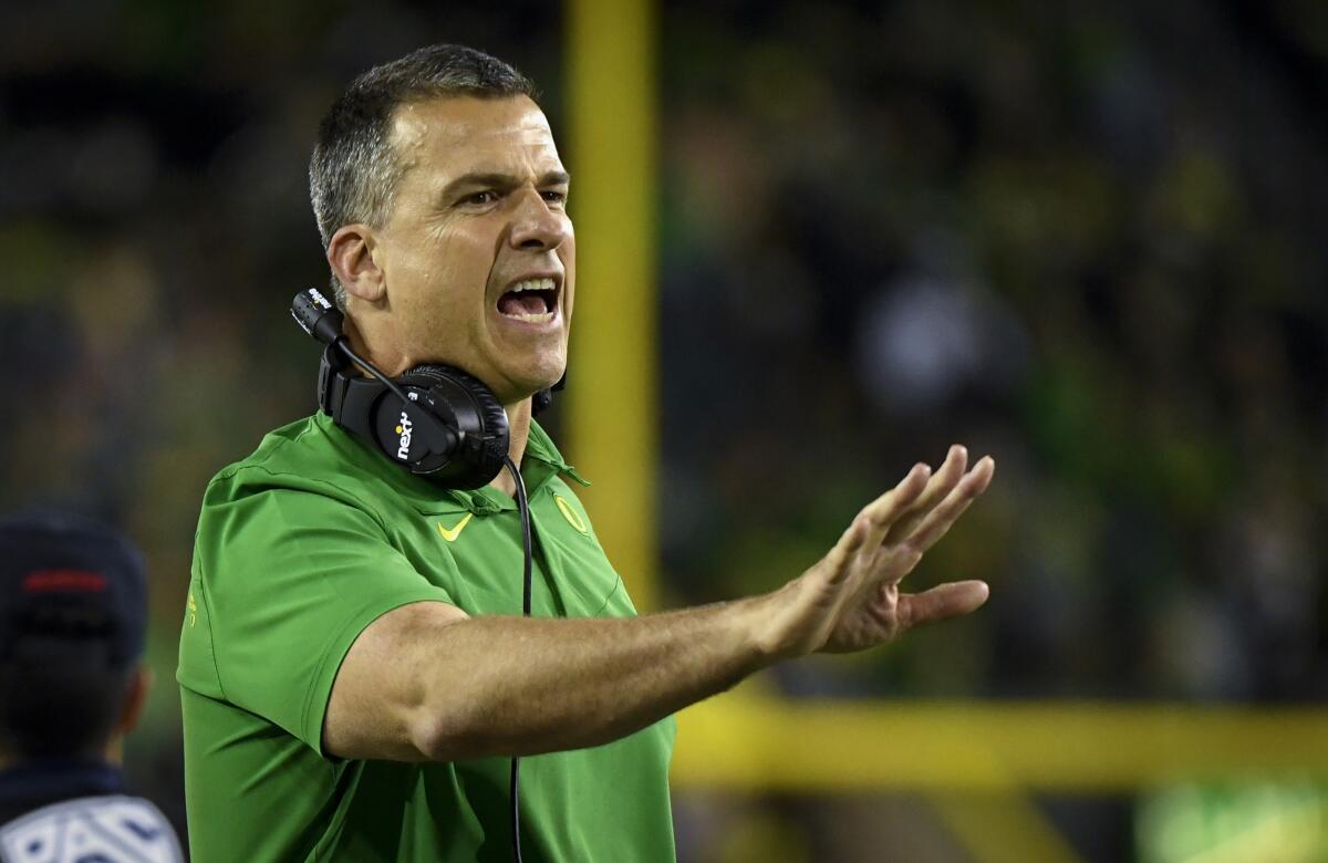 Oregon coach Mario Cristobal shouts during the Ducks' overtime loss to Stanford on Saturday.