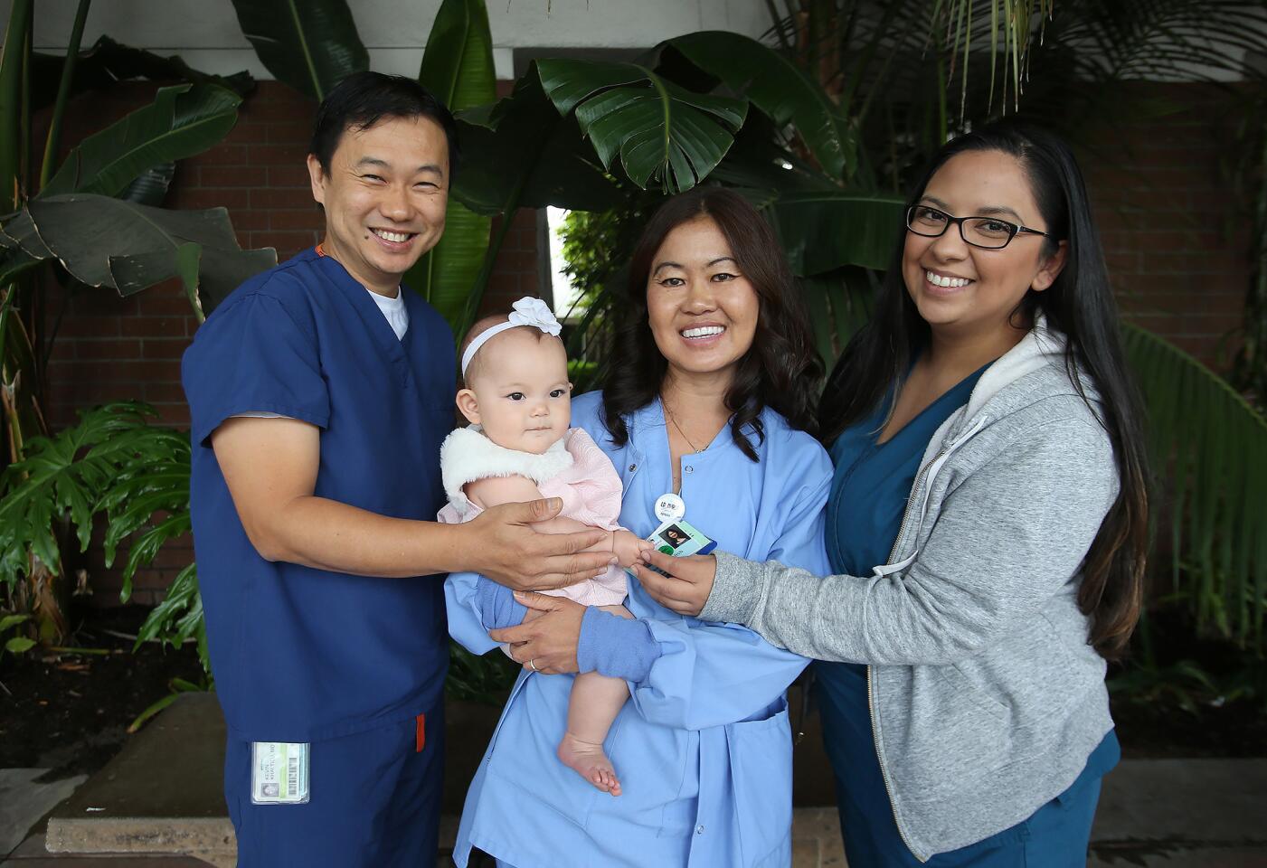 la-two-nurses-bring-baby-josephine-into-the-wo-002
