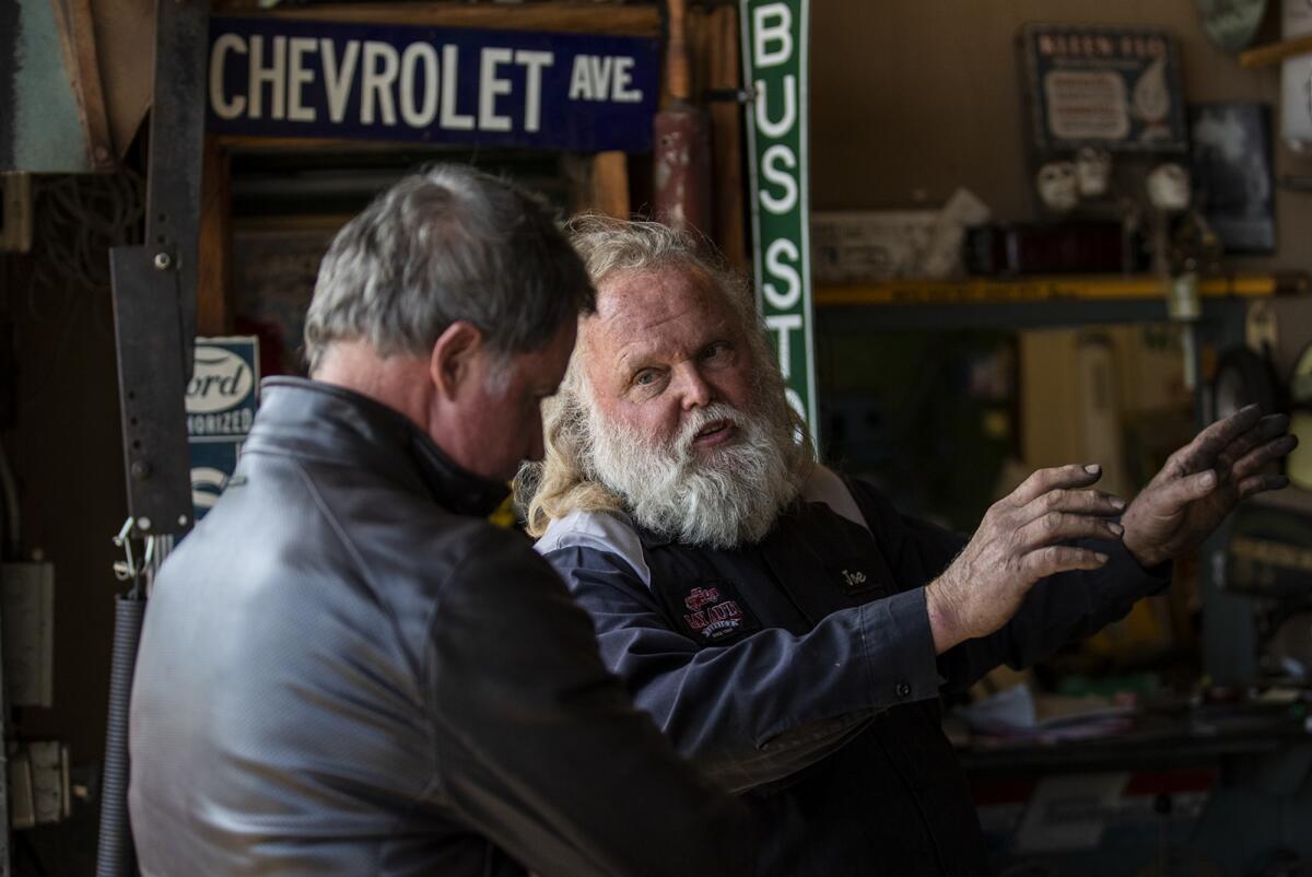 Joe Miracle, 70, speaks with a customer on Thursday.
