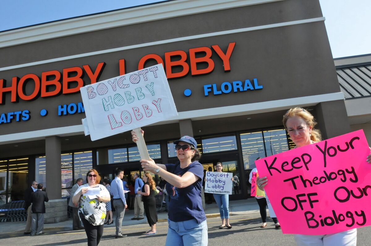Protesters outside of a Hobby Lobby store in Totowa, N.J.
