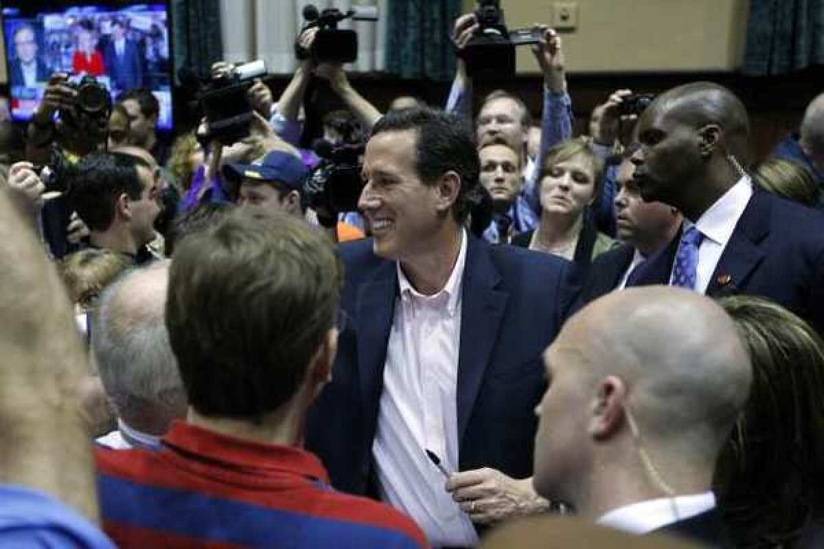 Rick Santorum greets supporters during an primary night rally in Gettysburg, Pa.