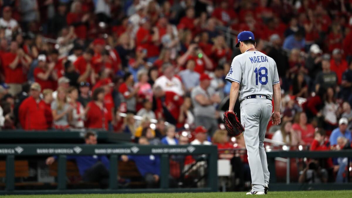 Dodgers pitcher Kenta Maeda leaves the game after giving up a two-run home run to St. Louis Cardinals catcher Yadier Molina during the sixth inning on Wednesday in St. Louis.